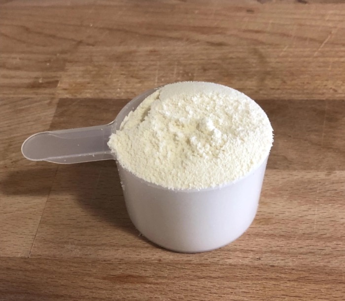 a full scoop of protein powder with the needed amount for preparing homemade protein pancake mix
