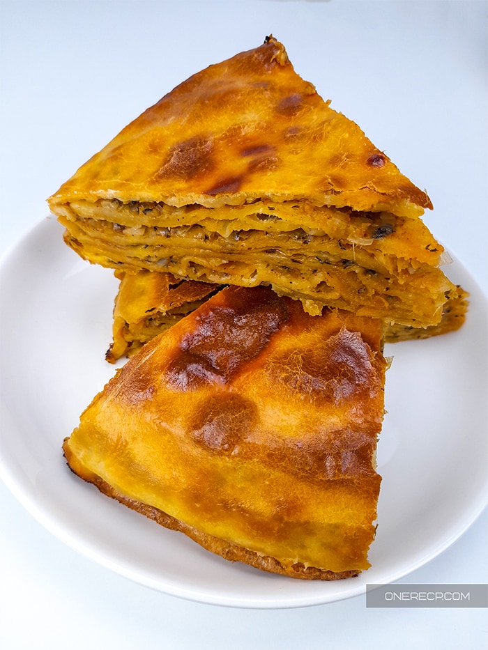 A serving of three slices of Bulgarian leek pie