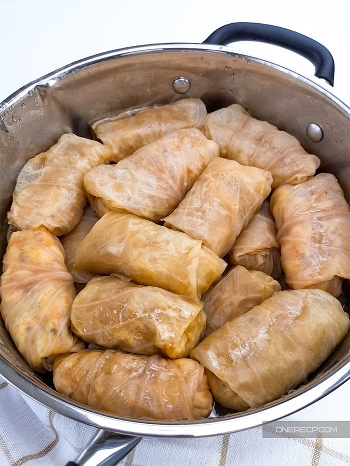A pot with fully cooked cabbage rolls