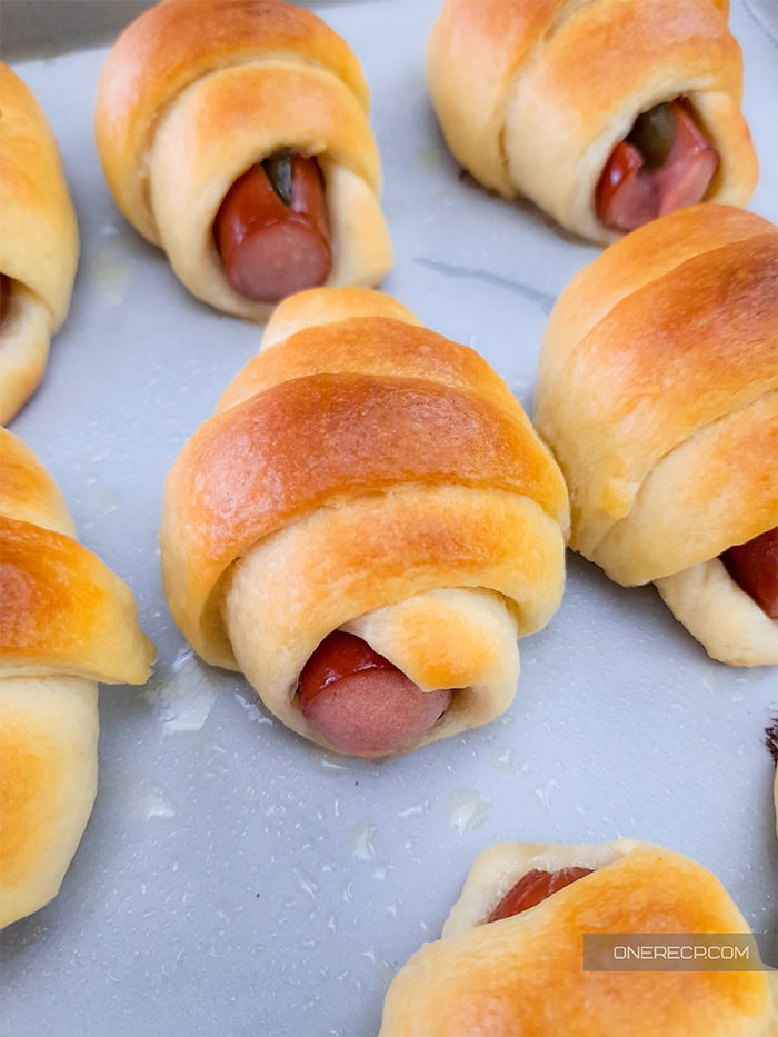 Close-up of baked crescent pigs in a blanket.