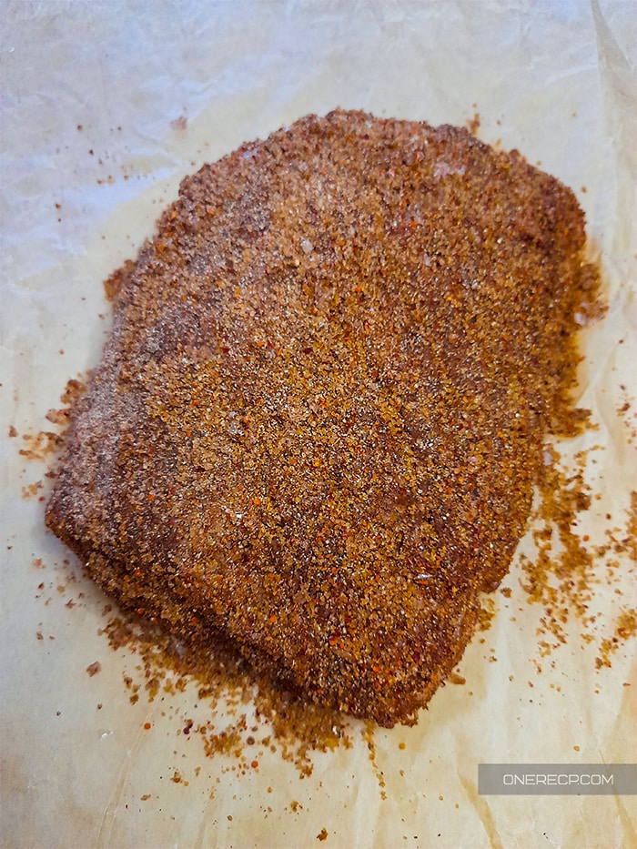 Dry cured pork shoulder on a cooking paper
