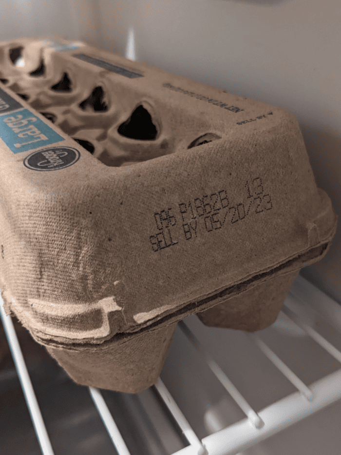 a carton of eggs with the expiration date clearly visible