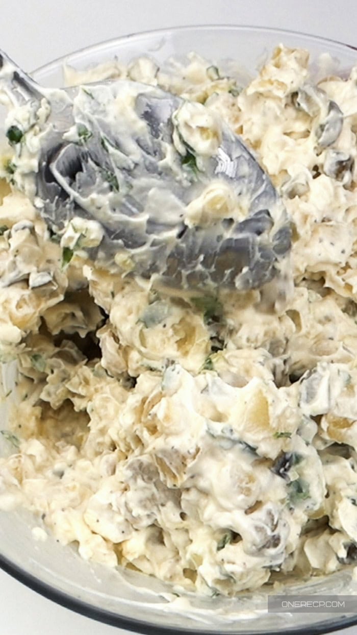 Creamy egg salad made with thawed hard-boiled egg yolks, mayonnaise, herbs, and chopped vegetables.