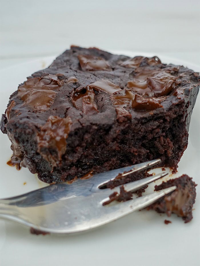 an eggless brownie sliced with a fork