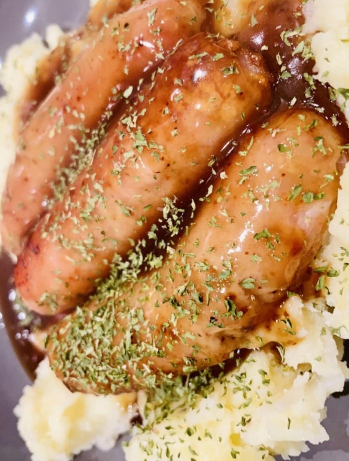 fried vienna sausages over a canopy of mashed potatoes