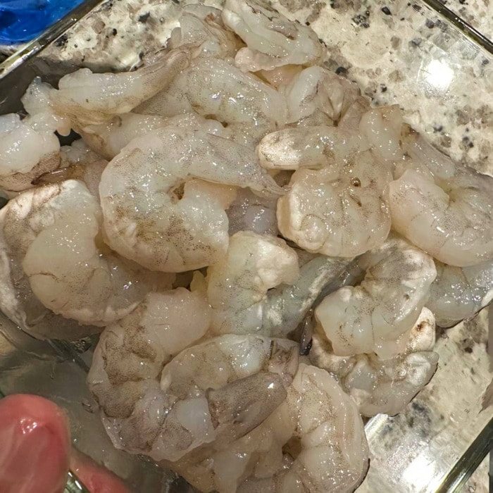 a pile of freshly thawed shrimp