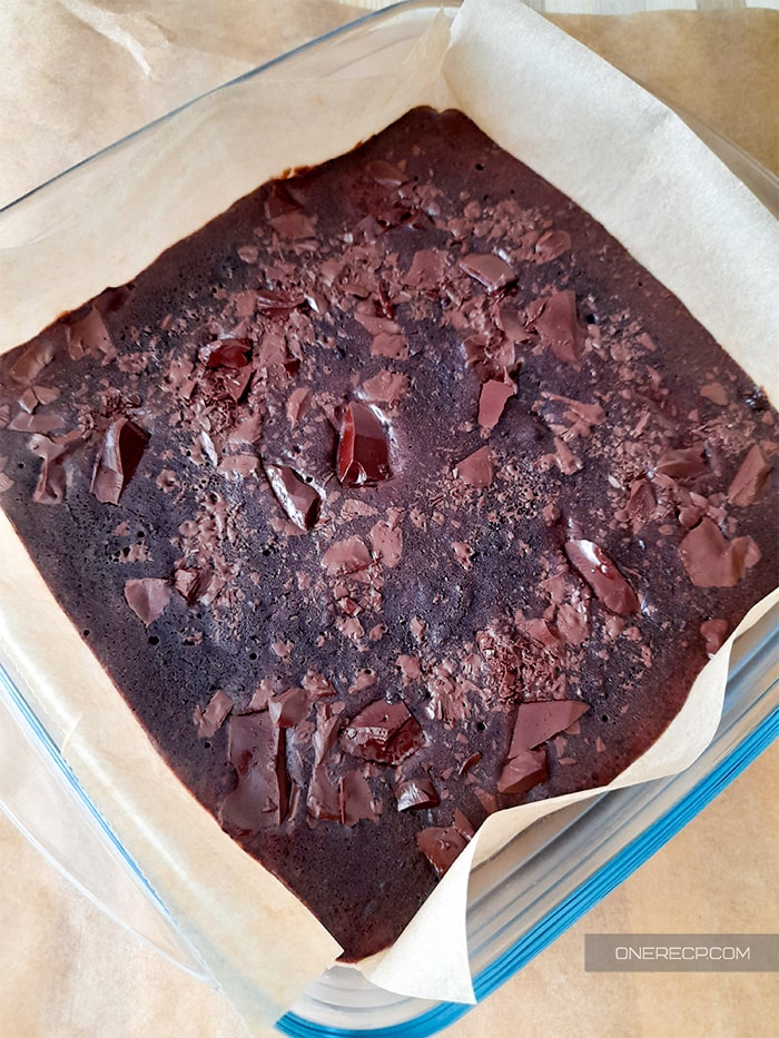 what the warm brownie mix without eggs looks like after being microwaved in parchment paper
