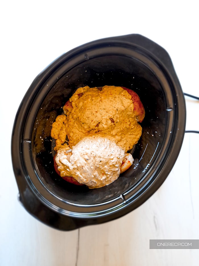 Chicken breast covered with sauce in a Crockpot