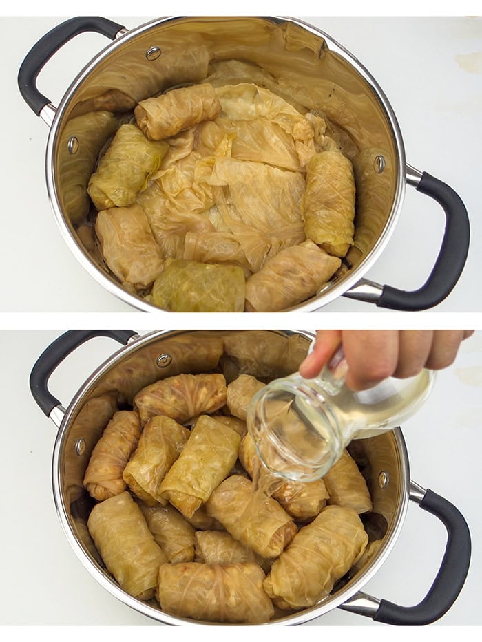 Spreading the cabbage rolls on the bottom of a pot and filling the pot with water