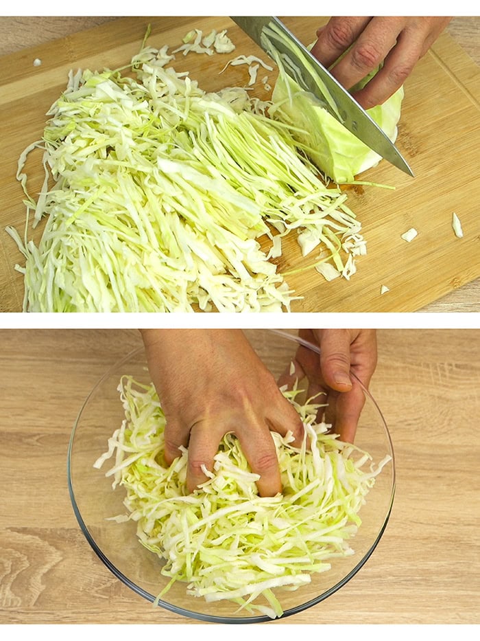 Chopping cabbage and hand mixing it in a glass bowl.