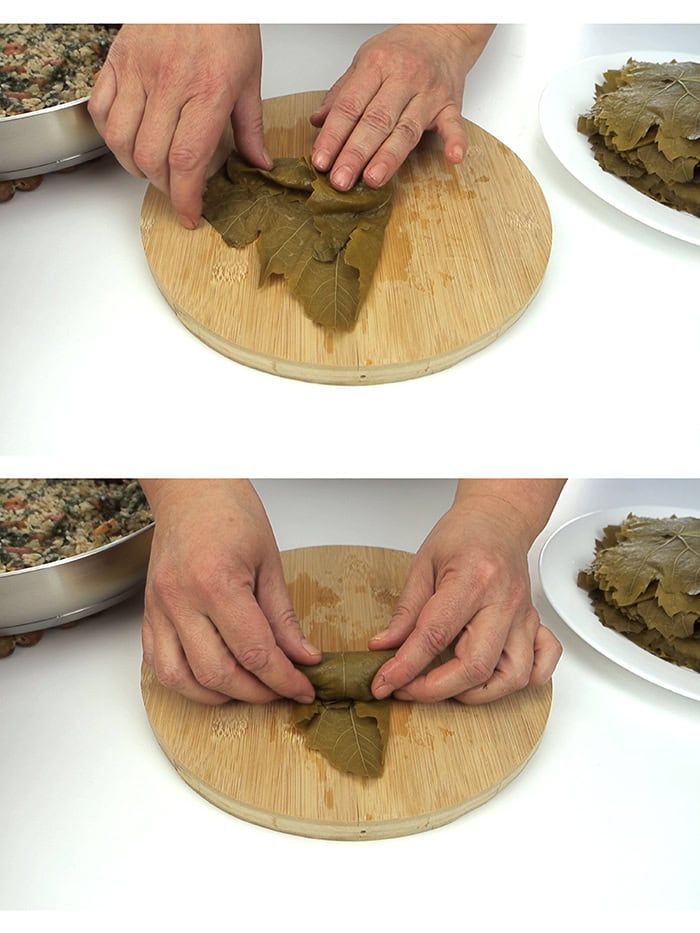 Tucking grape leaf and rolling it into a log