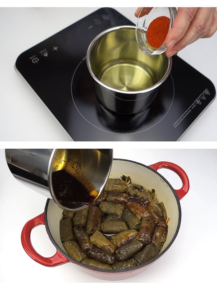 Sauteing paprika in vegetable oil and pouring the mixture over the stuffed grape leaves