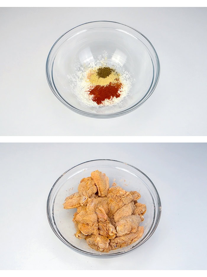 A bowl with the spices for the chicken wings next to a bowl with seasoned chicken wings