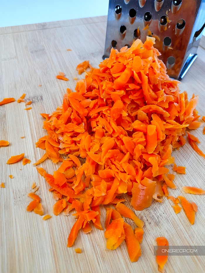 Shredded pickled carrots on a cutting board