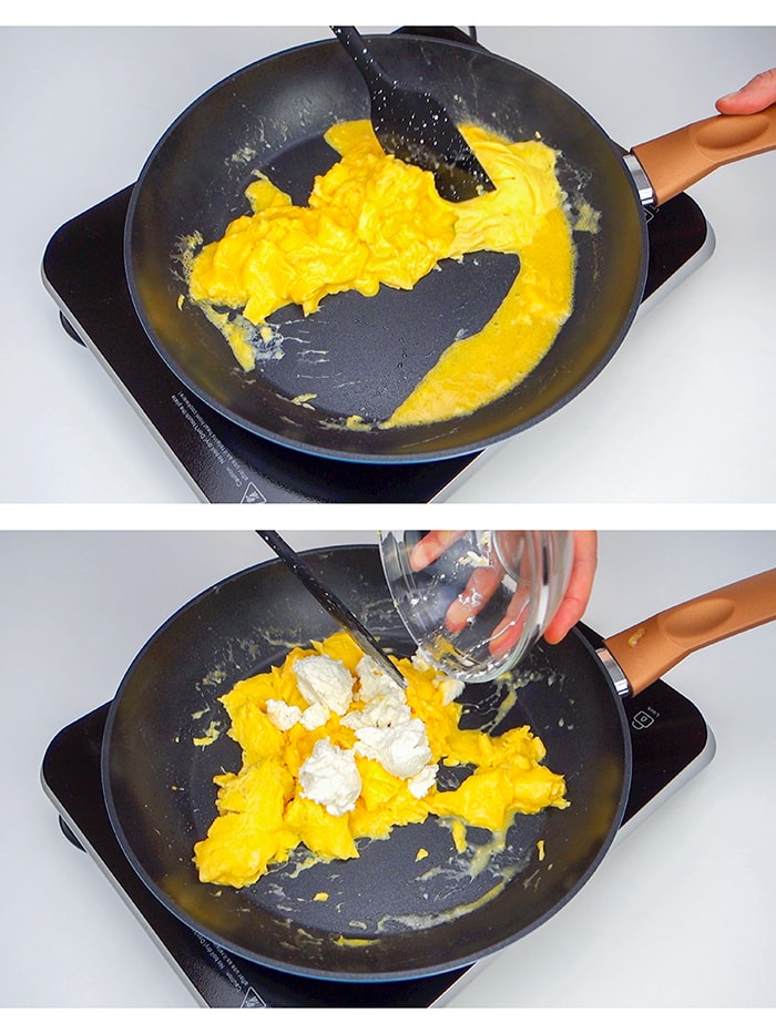 Stirring eggs with a spatula and adding ricotta cheese