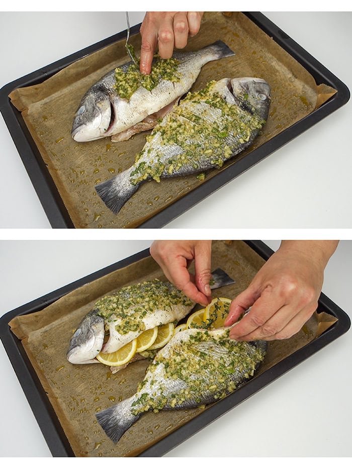 Applying seasoning to sea bream and stuffing it with sliced lemons