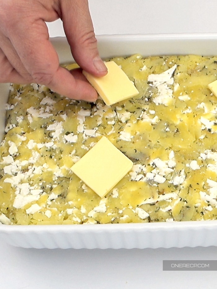 Topping potato casserole with unsalted butter