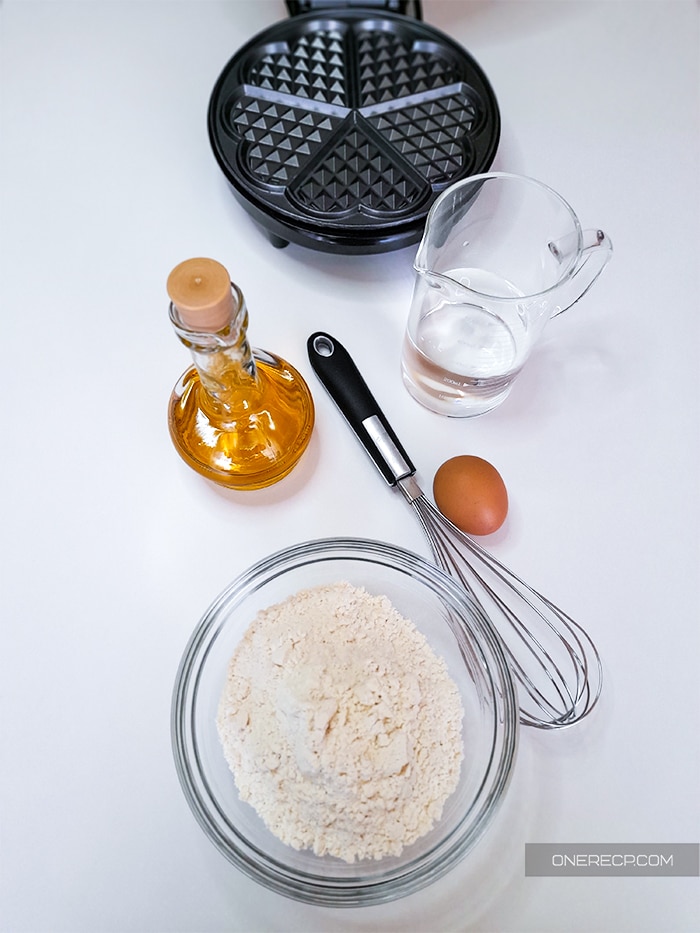 Ingredients and tools for waffles with made with a pancake mix