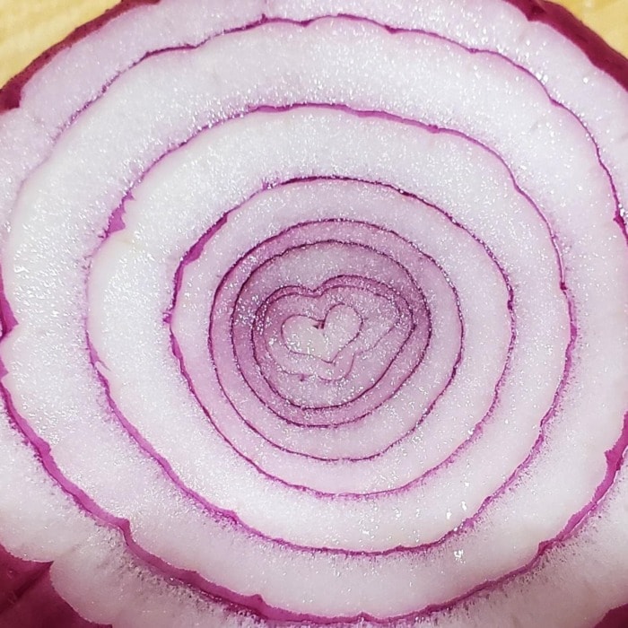 a close up of an onion cut in the middle