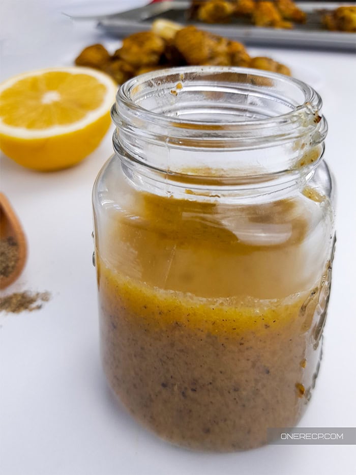 A jar with lemon pepper sauce