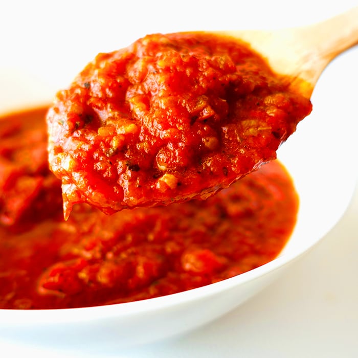 make tomato sauce less acidic