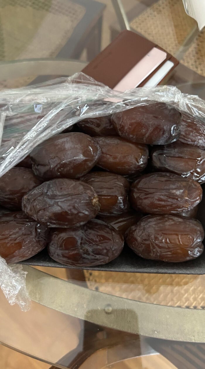 A close-up of glossy Medjool dates, one of the best natural sweeteners for baking and making healthy dessert pastes.