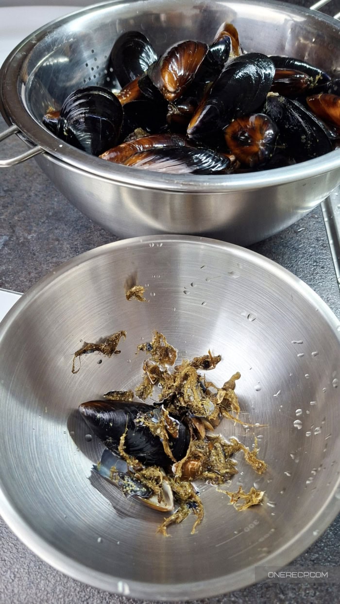 Mussel beards and debris removed while cleaning a batch of mussels