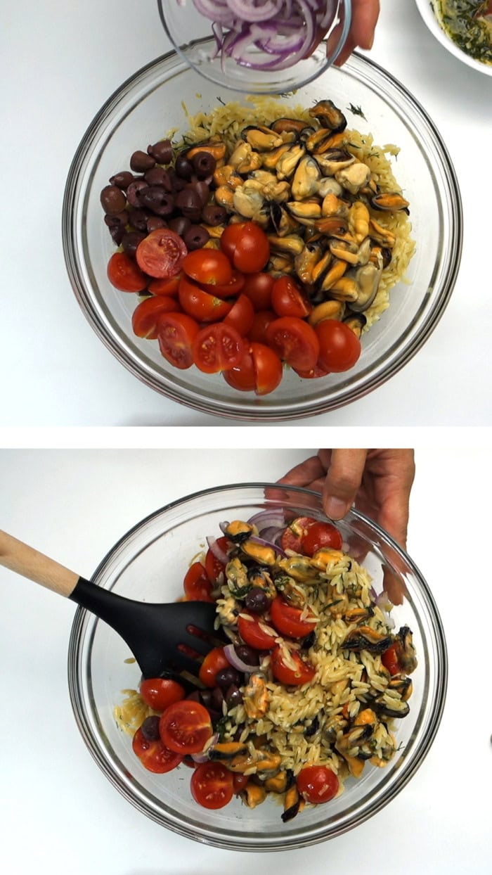 Adding red onion to orzo, mussels, tomatoes, and olives, then tossing the salad
