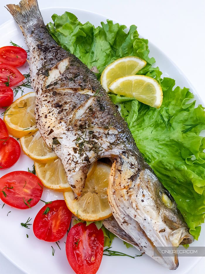 A serving of oven roasted whole branzino