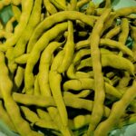 close up of raw pole green beans