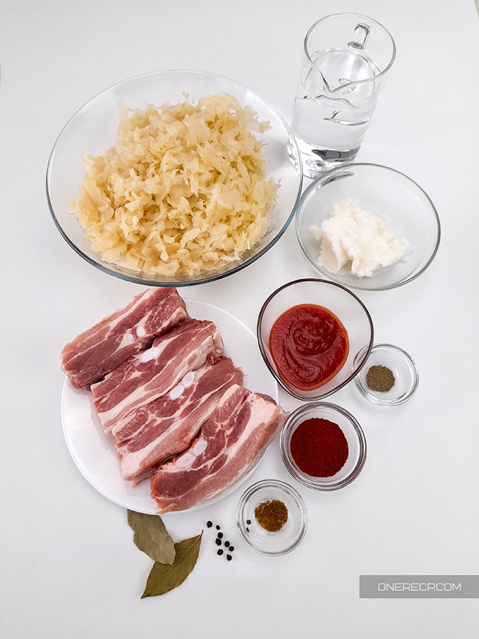 Ingredients for pork and sauerkraut arranged on a table