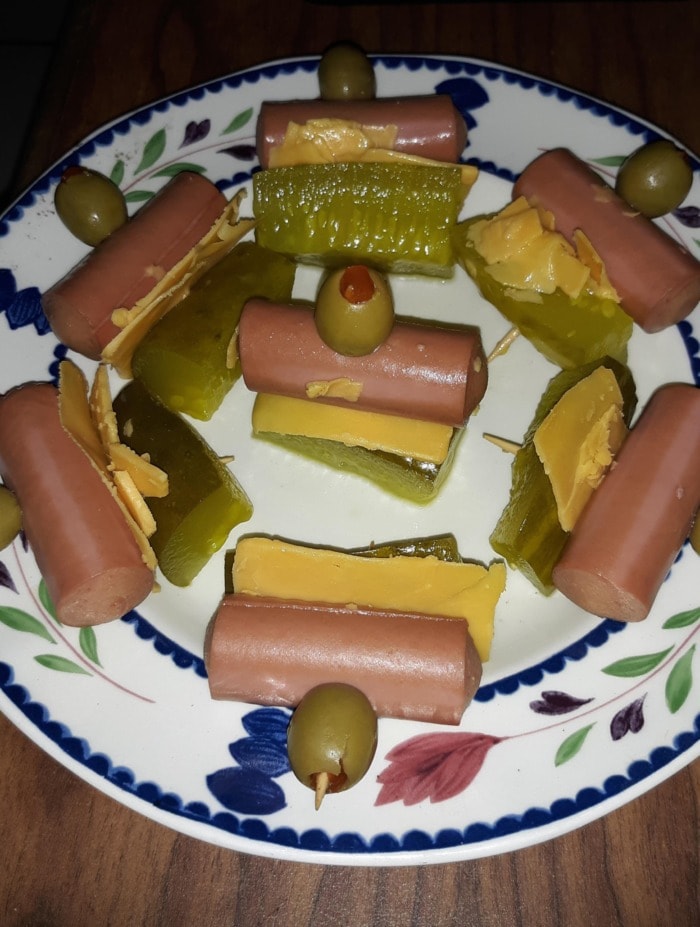 a quick snack with vienna sausages, olives and pickles