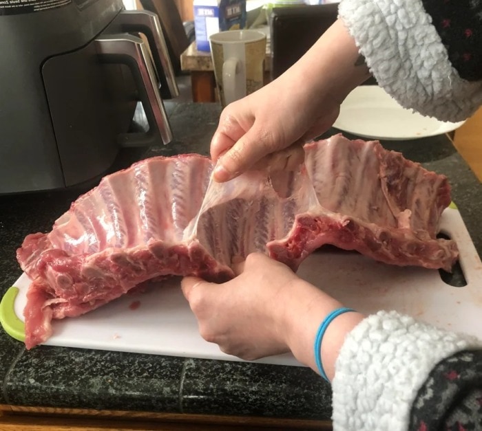 pulling the silverskin off a rack of ribs manually
