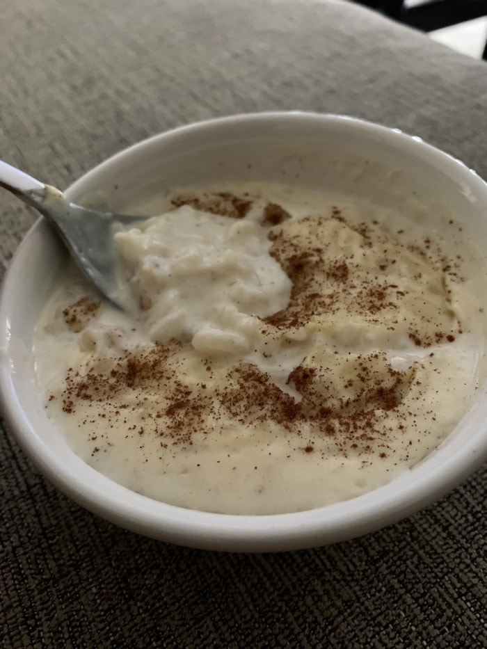 a bowl of rice pudding with cinammon