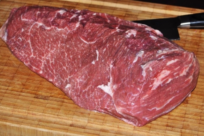 trimmed rump roast cut placed on а cutting board