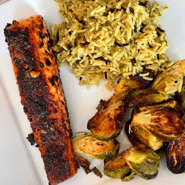 roasted salmon fillet with long rice and brussels sprouts