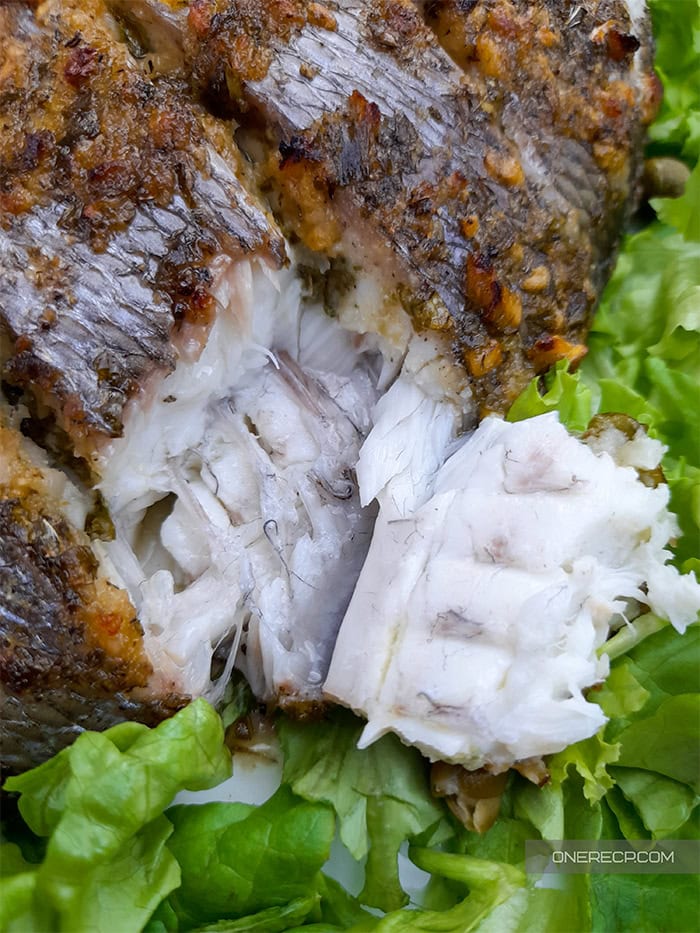 Close-up of oven roasted sea bream where the tender meat inside can be seen