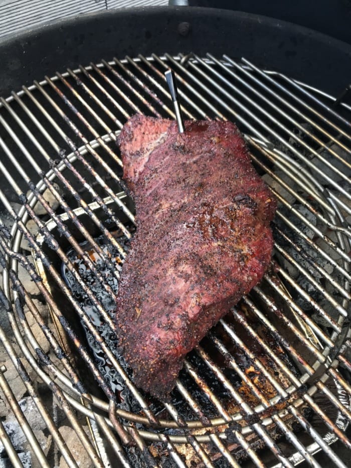 smoking dry-rubbed rump roast on a grill