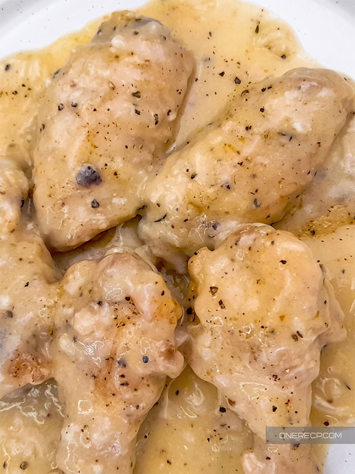 Close-up of smothered chicken wings