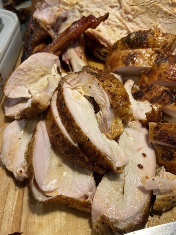 Cuts of Thanksgiving turkey breast on a cutting board