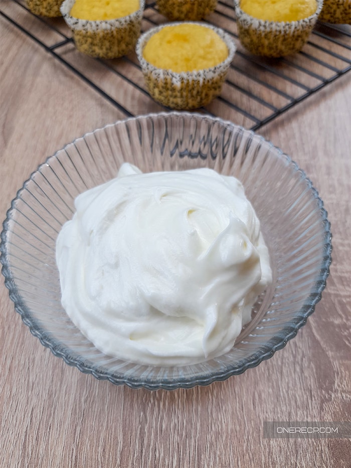 showing the final result for the butterless vanilla frosting in a glass bowl
